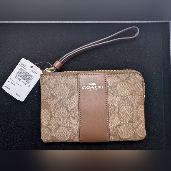 Coach Handbags - Coach Brown Signature Zip Wristlet with Leather Band